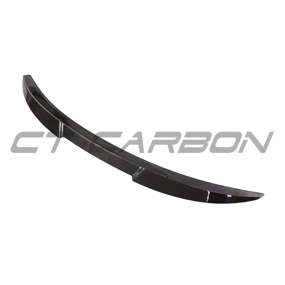 BMW G82 M4 full carbon fibre kit by CT Carbon, featuring a sleek carbon fibre spoiler and aerodynamic components.