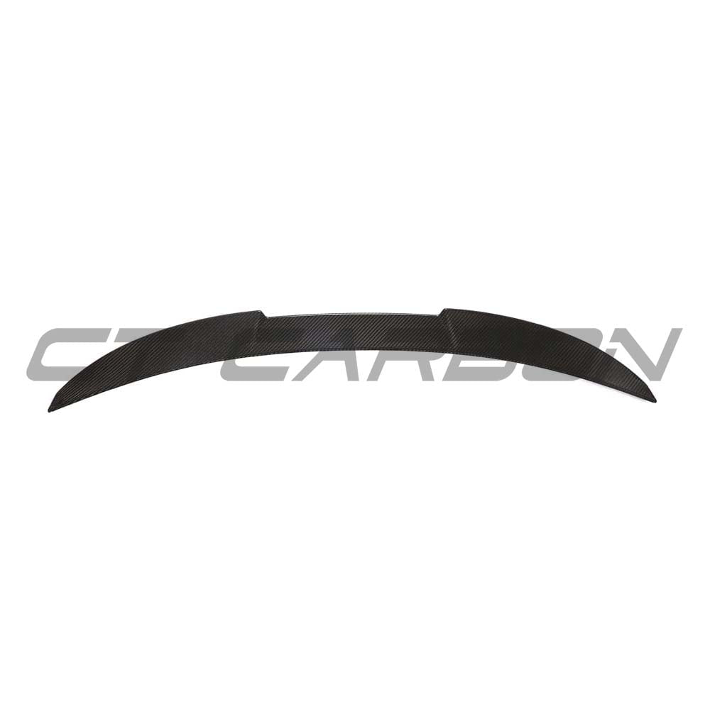 BMW G82 M4 full carbon fibre kit by CT Design, including spoiler and body parts, showcasing a sleek carbon fibre finish.