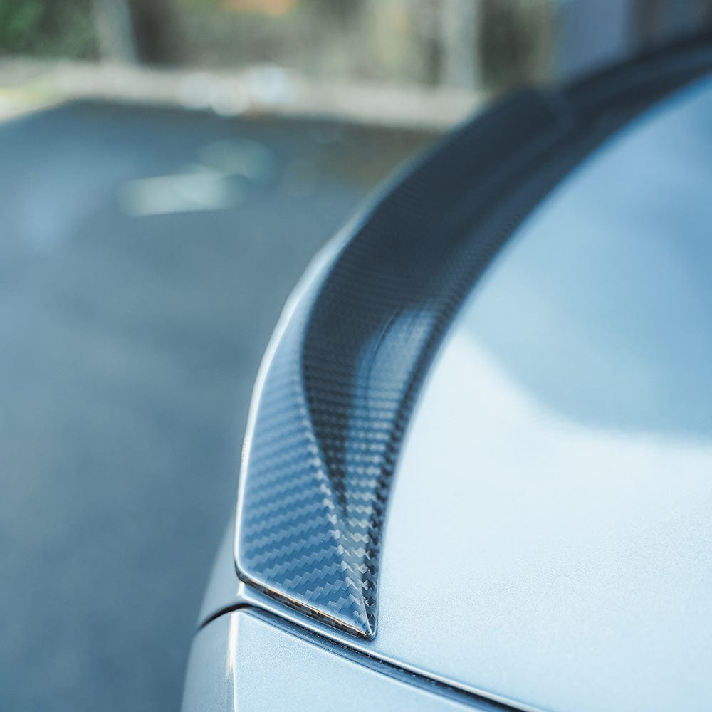 BMW M4 G82 G22 Carbon Fibre Spoiler by CT Carbon, V4 style, showcasing the sleek, aerodynamic design on the sports car.