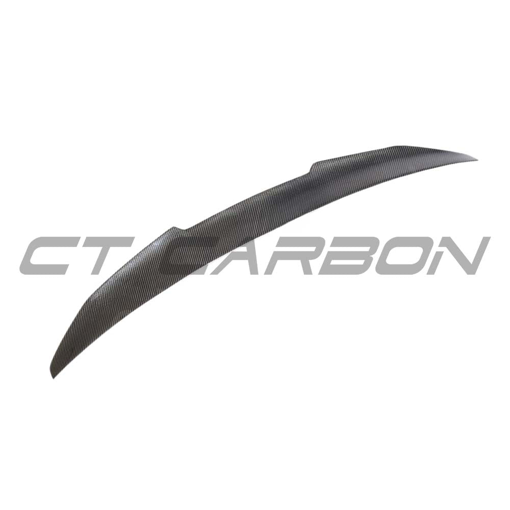 BMW G30 5 Series carbon fibre kit by CT Carbon, including spoiler and ducktail, with a sleek carbon fibre finish.