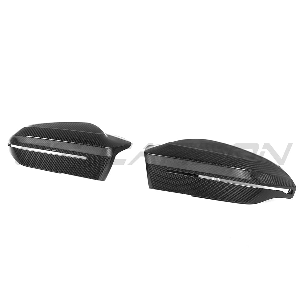 BMW M5 G90, 5 Series, and i5 G60 carbon fibre side mirrors by CT Carbon, RHD, showcasing sleek aerodynamic design.