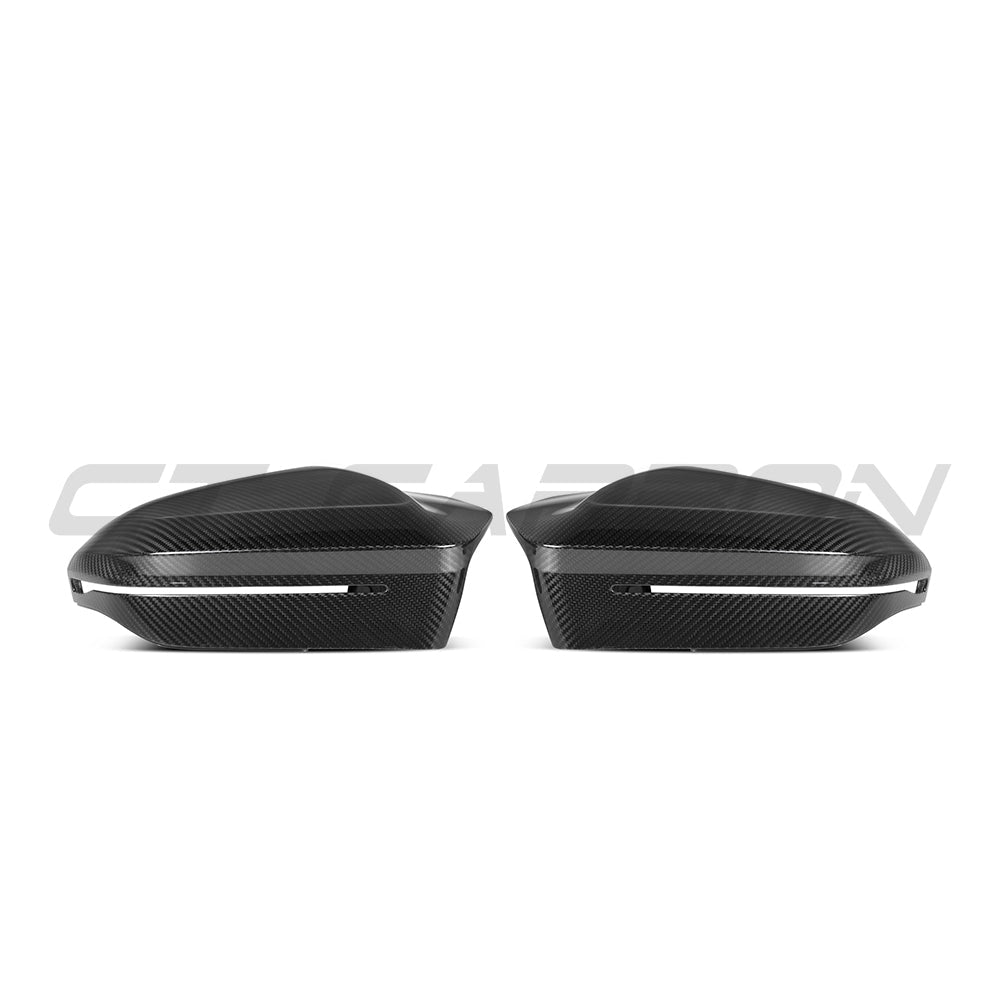 BMW M5 G90 and G99 carbon fibre side mirrors by CT Carbon, RHD, for 5 Series and i5 models, showcasing sleek carbon fiber design.