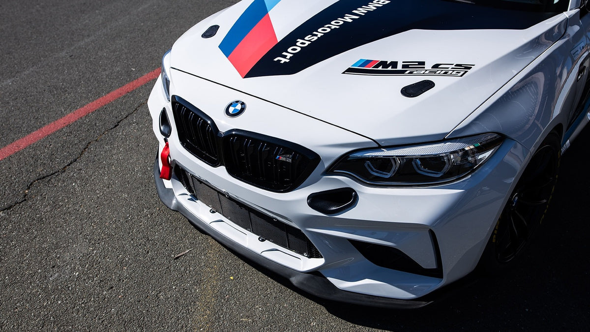 Genuine BMW Motorsport M2 CS Racing brake ducts shown on a BMW M2 CS vehicle, designed for improved cooling and performance.
