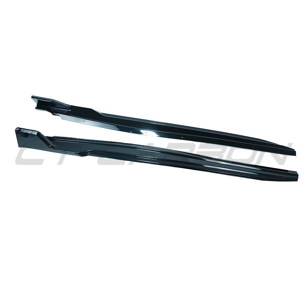 BMW U10 X2 2023 gloss black side skirts by CT Carbon, shown on the vehicle, highlighting sleek aerodynamic design.