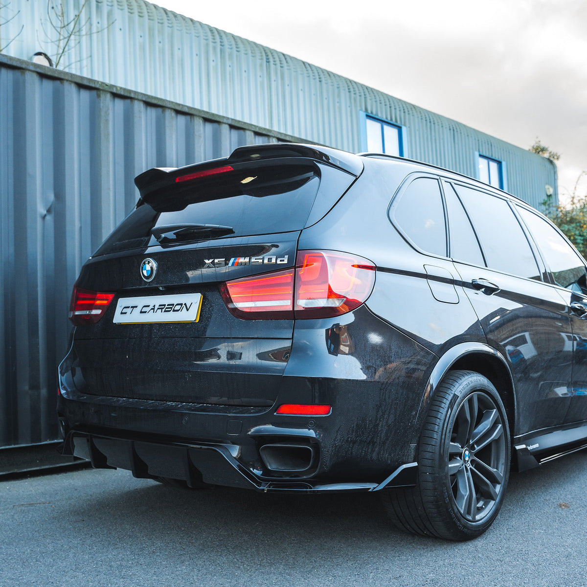 BMW F15 X5 2014-2018 CT Carbon full gloss black kit with sleek, shiny exterior accessories shown on the vehicle.