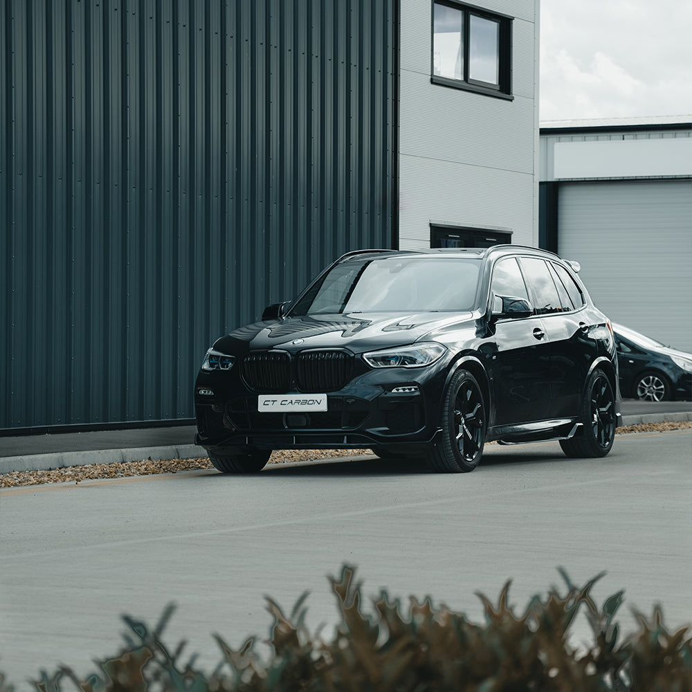 BMW X5 G05 2018+ CT Carbon black double slat grille, automotive accessory, close-up view showing the sleek gloss black finish.