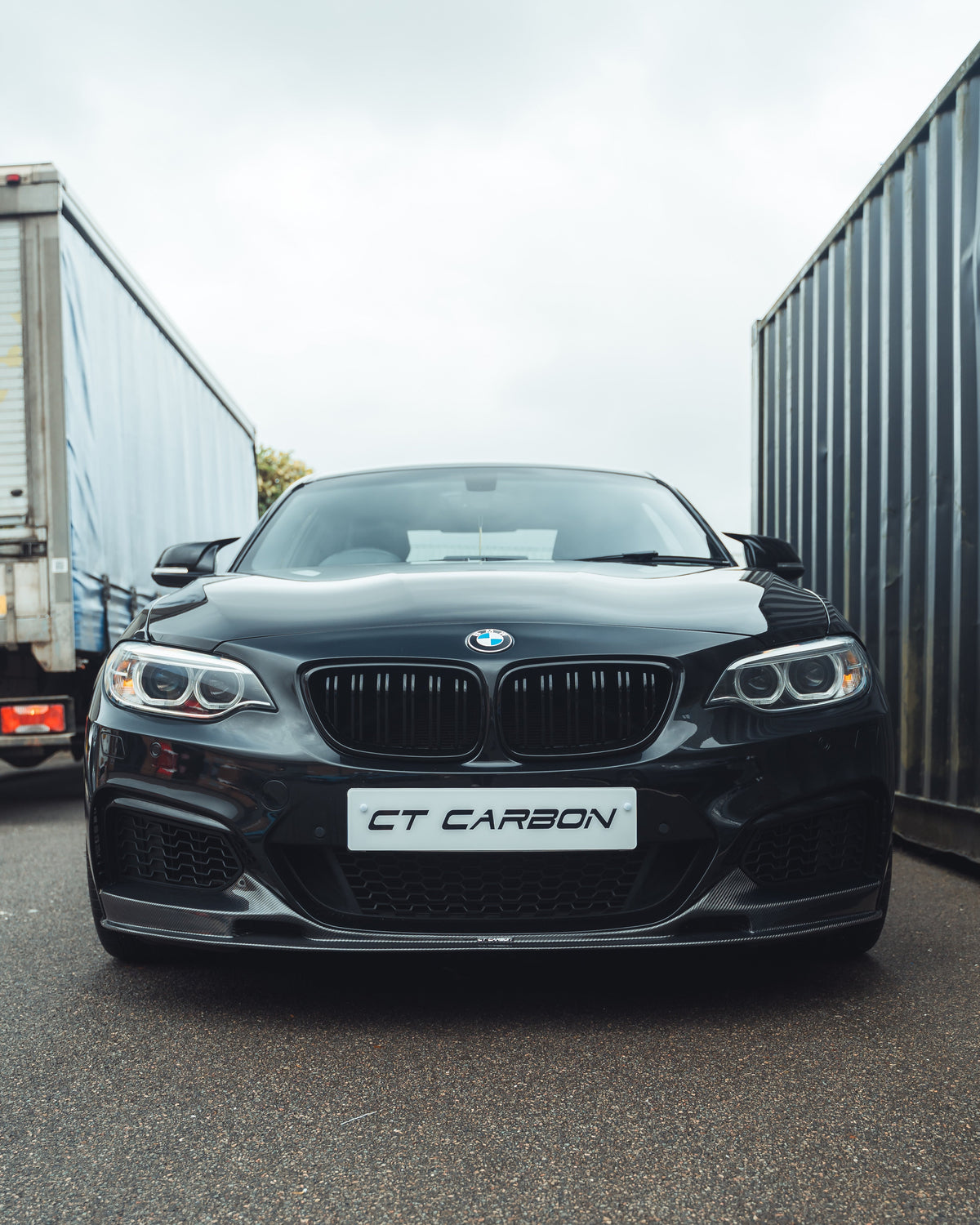 BMW F22 2 Series full carbon fiber kit by CT Carbon, showing the sleek, lightweight carbon fiber panels on the car.