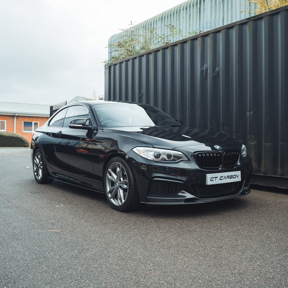 BMW F22 2 Series full carbon fiber kit by CT Carbon, showing detailed view of the lightweight, high-gloss carbon fiber components.