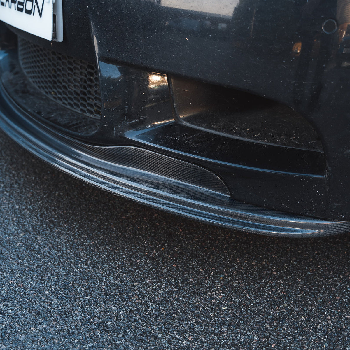 BMW M3 E92/E90 carbon fibre splitter V1 by CT Carbon, showcasing the sleek aerodynamic front splitter design.