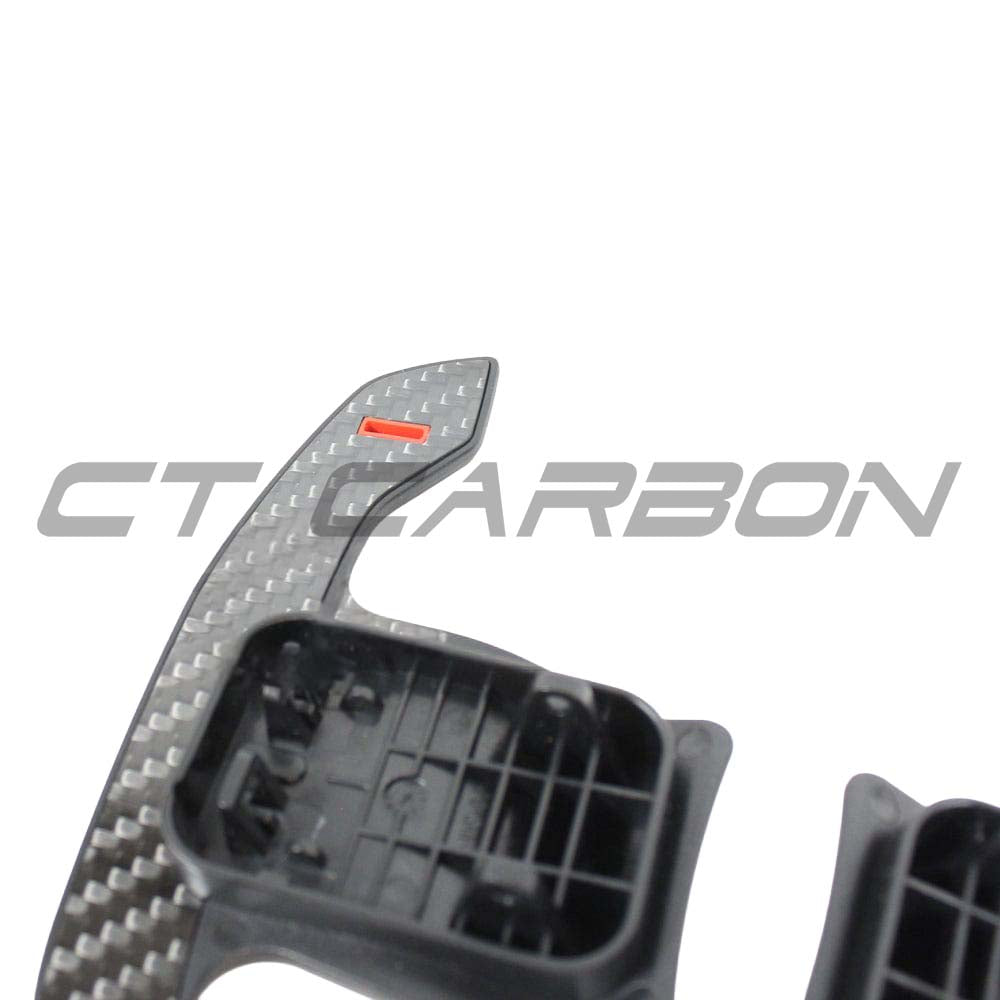 BMW Mini Fxx Gxx carbon fibre shifter paddles by CT Carbon, close-up of sleek, lightweight paddle accessories for sporty driving.