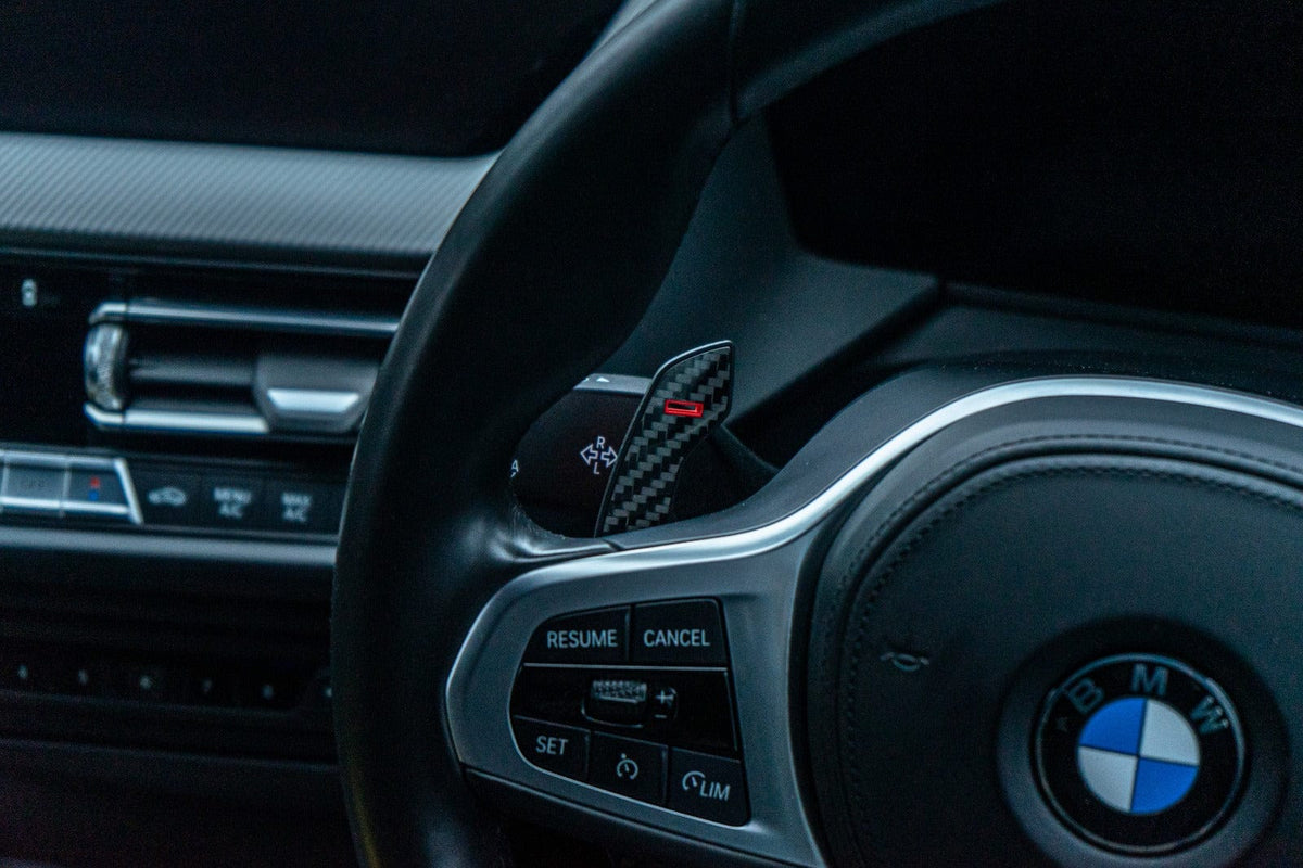 BMW and MINI Fxx Gxx carbon fiber shifter paddles by CT Carbon, sleek lightweight accessories for enhanced driving feel.