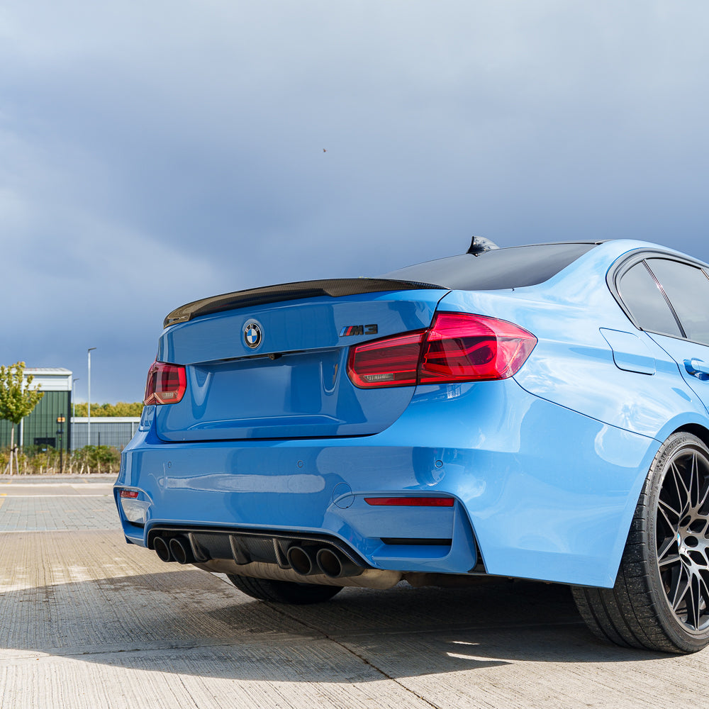 Blue BMW M3 F80 full carbon fiber kit by CT Carbon, showcasing lightweight, high-performance carbon fiber parts for the vehicle.