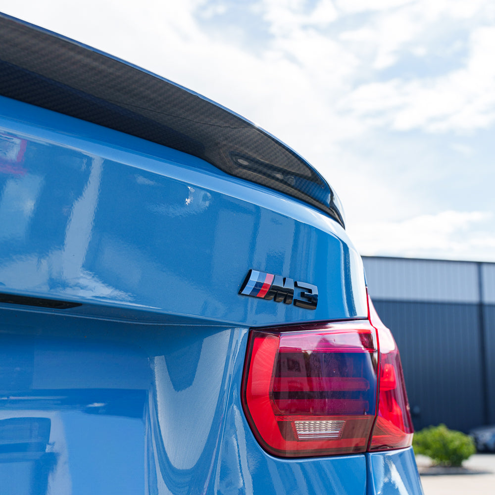 Blue BMW M3 F80 full carbon fiber kit by CT Carbon, showcasing lightweight, aerodynamic exterior parts on the car.