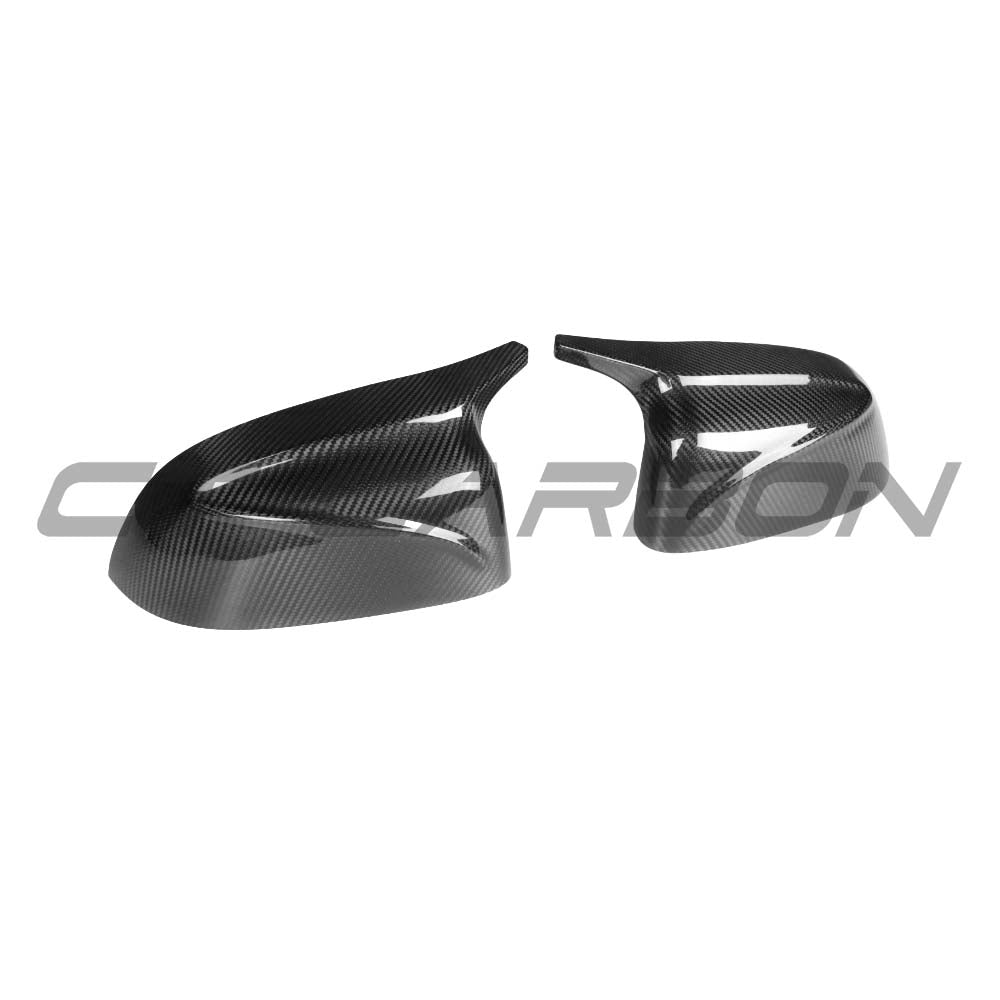 BMW G01 G02 G05 G06 G07 G08 X3 X4 X5 X6 X7 carbon fibre mirrors by CT Carbon, close-up view of sleek, aerodynamic side mirrors.