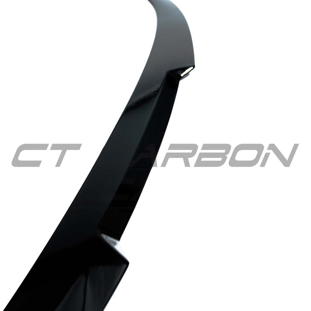 BMW 4 Series F32 gloss black spoiler by CT Carbon, shown on car, enhances sporty appearance with sleek aerodynamic design.