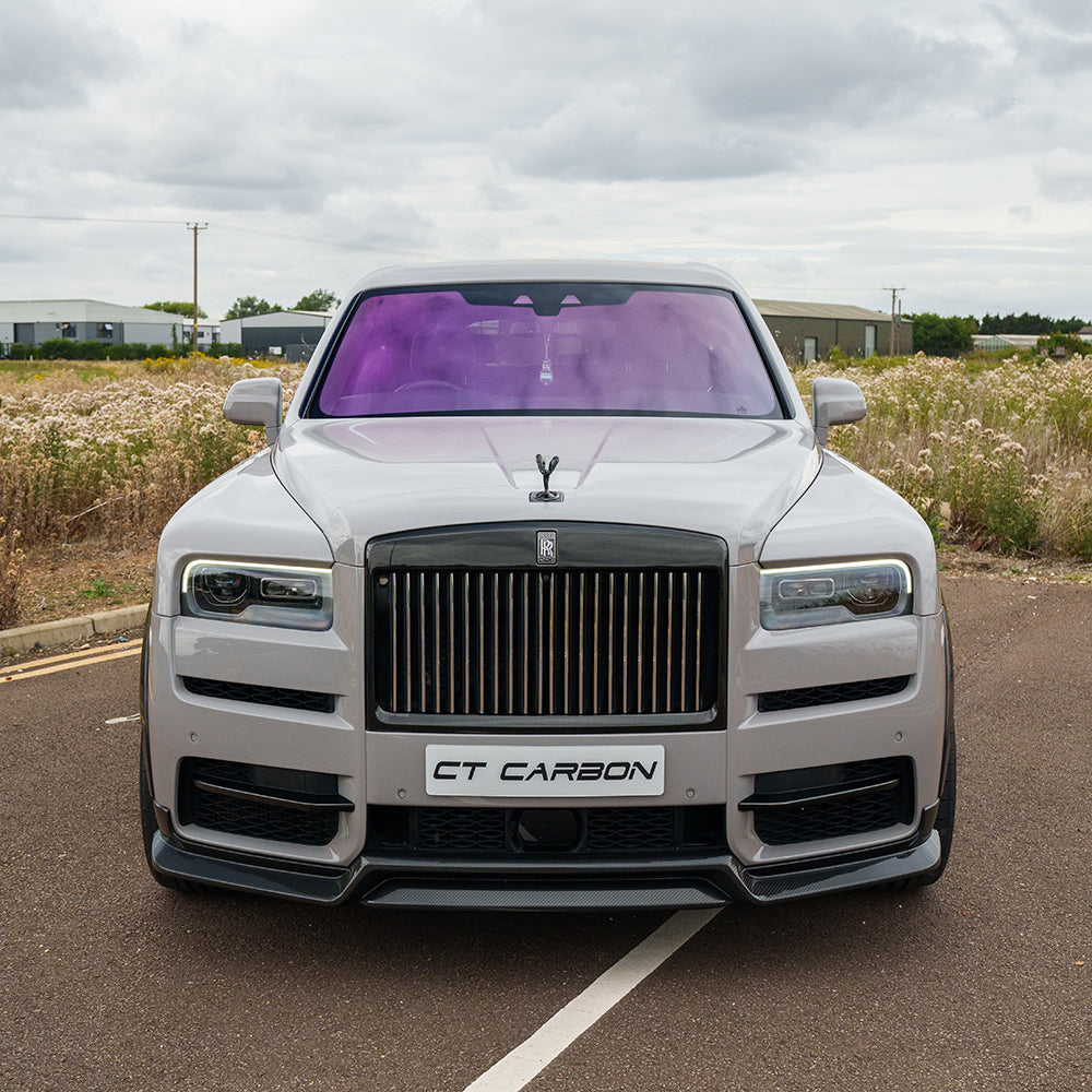 Full car carbon fiber kit for Rolls Royce Cullinan by CT Carbon, showcasing sleek, glossy carbon fiber components on the vehicle.