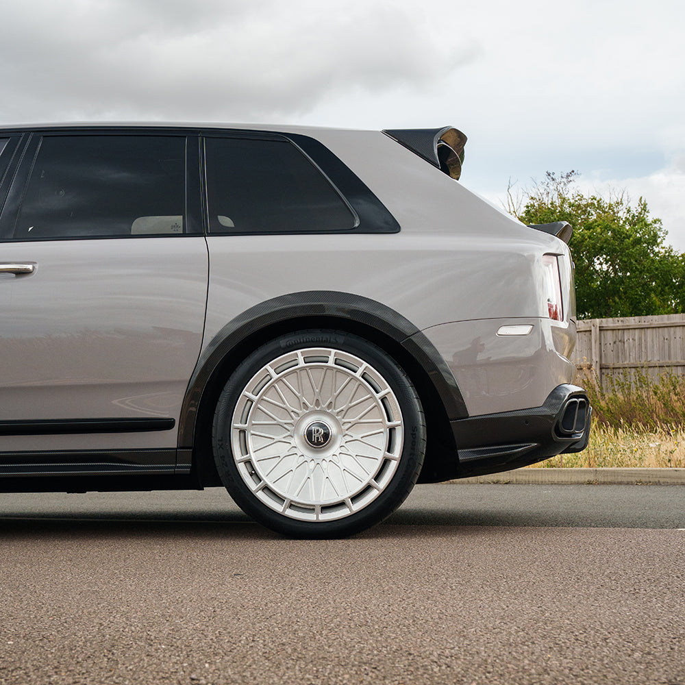 Full car carbon fiber kit for Rolls Royce Cullinan by CT Carbon, showing the sleek, lightweight carbon fiber panels on the vehicle.