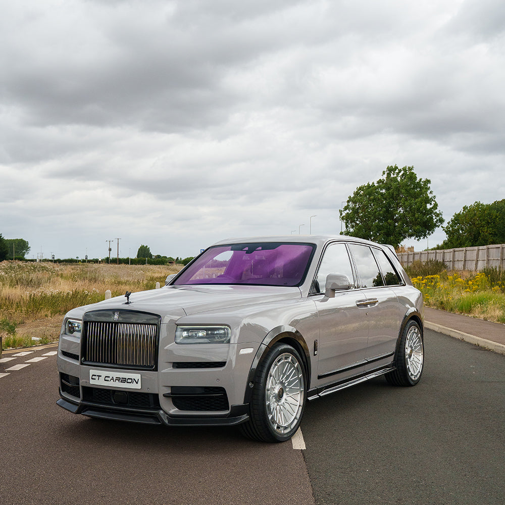 Full carbon fibre kit for Rolls Royce Cullinan by CT Carbon, shown on the luxury SUV with detailed exterior components.