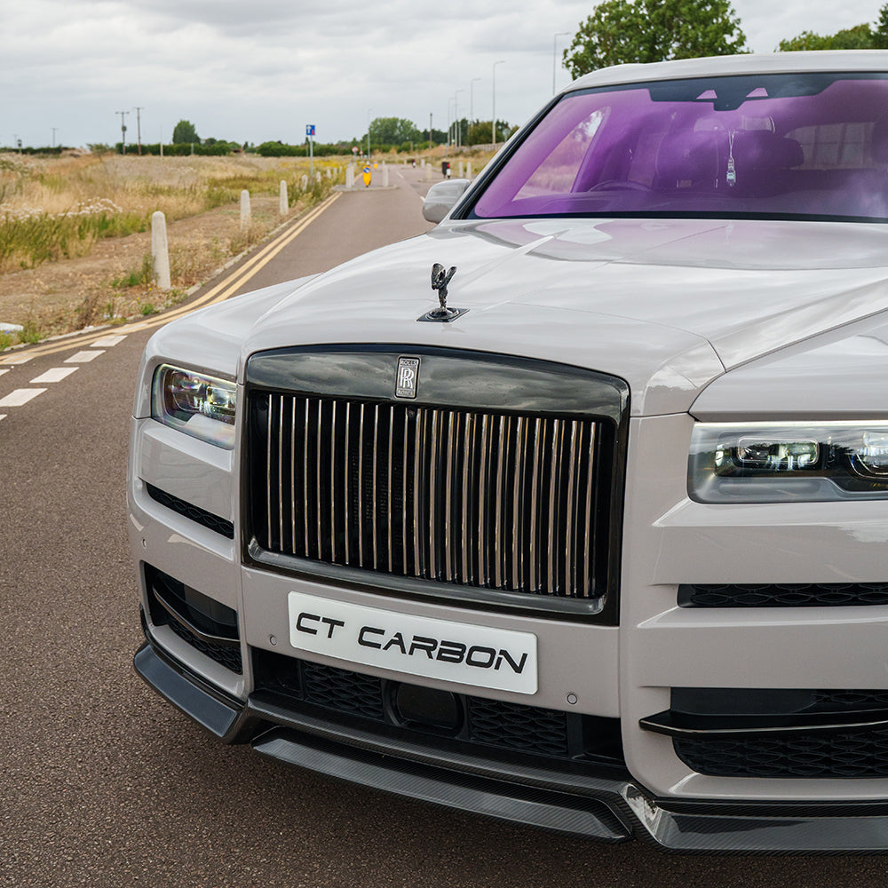 Carbon fiber splitter for Rolls Royce Cullinan by CT Carbon, showing the sleek, aerodynamic design on the luxury SUV.