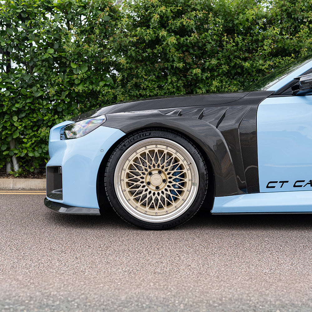 BMW G87 M2 CT Carbon full carbon fiber kit installed on car, showcasing lightweight, high-performance carbon fiber components.