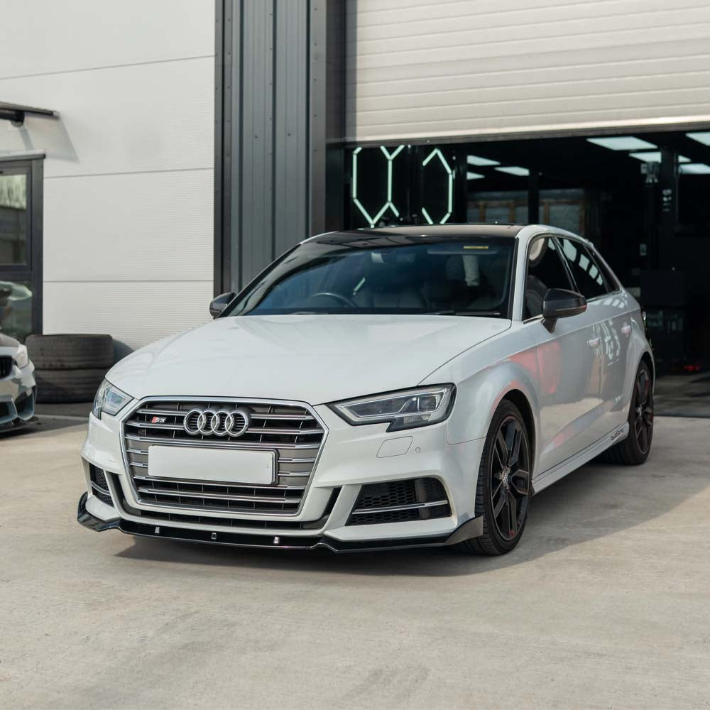 Gloss black splitter for Audi A3 S-Line and S3 8V facelift 2017-2020 by CT Carbon, shown on the front bumper.