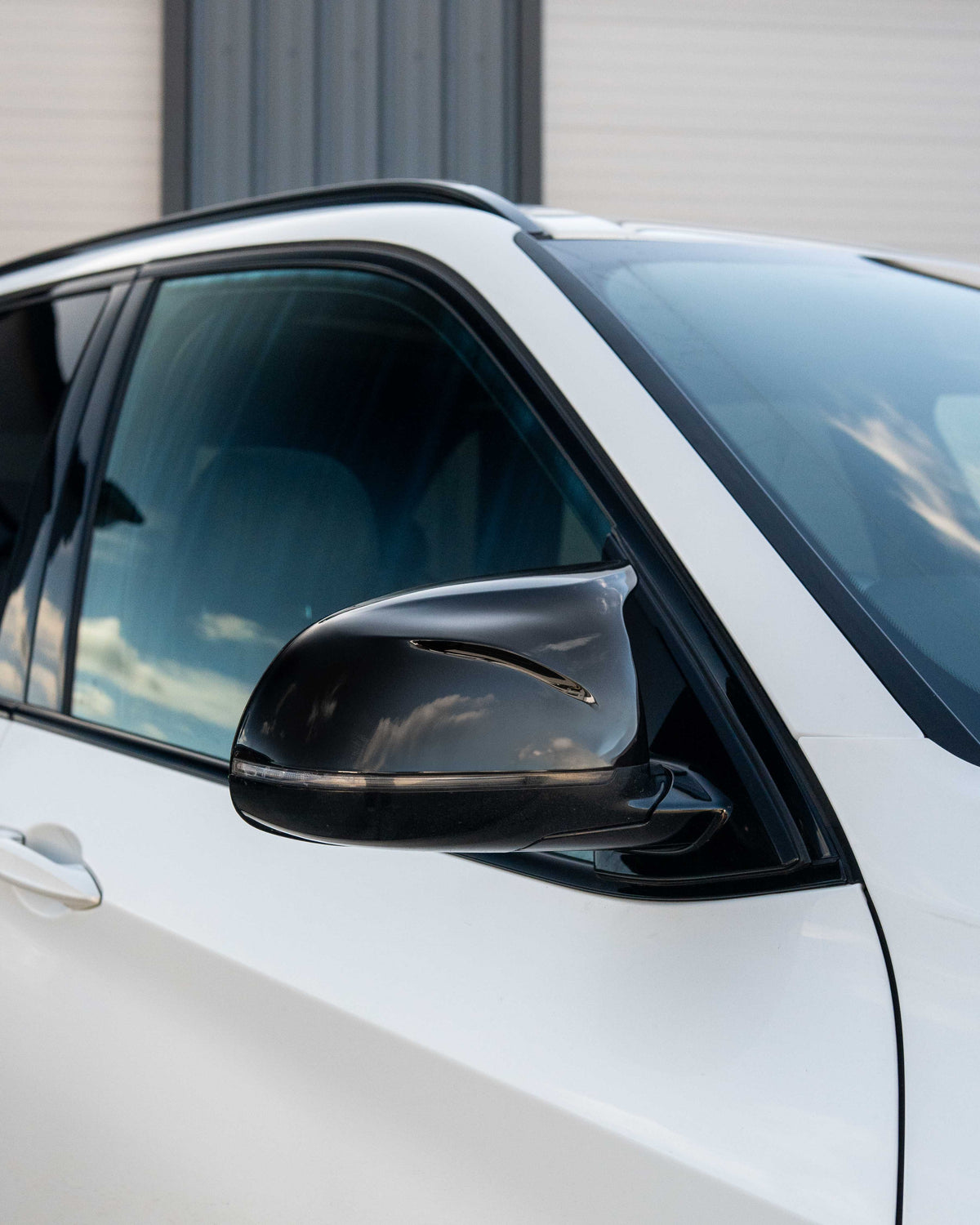 BMW F15/F16 X5/X6 2014-2018 GLOSS BLACK MIRRORS by CT Carbon, close-up of stylish glossy black side mirror accessories.