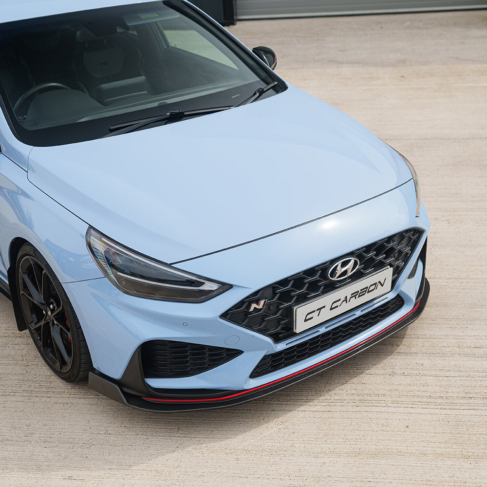 CT Carbon Hyundai i30N Carbon Fibre Kit (Facelift) installed, showcasing sleek carbon fibre accents on the car's exterior.