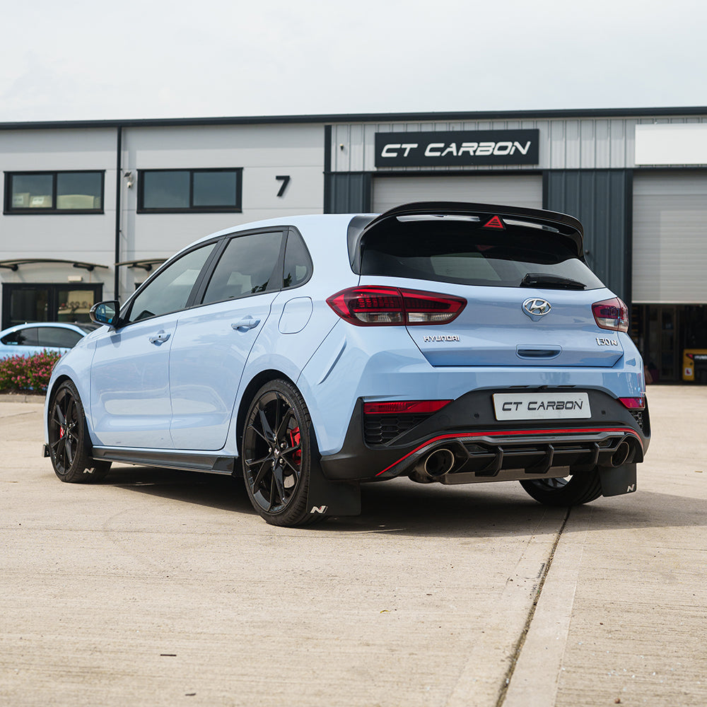 Hyundai i30N carbon fibre diffuser by CT Carbon, front view showcasing sleek design and textured finish for facelift model.