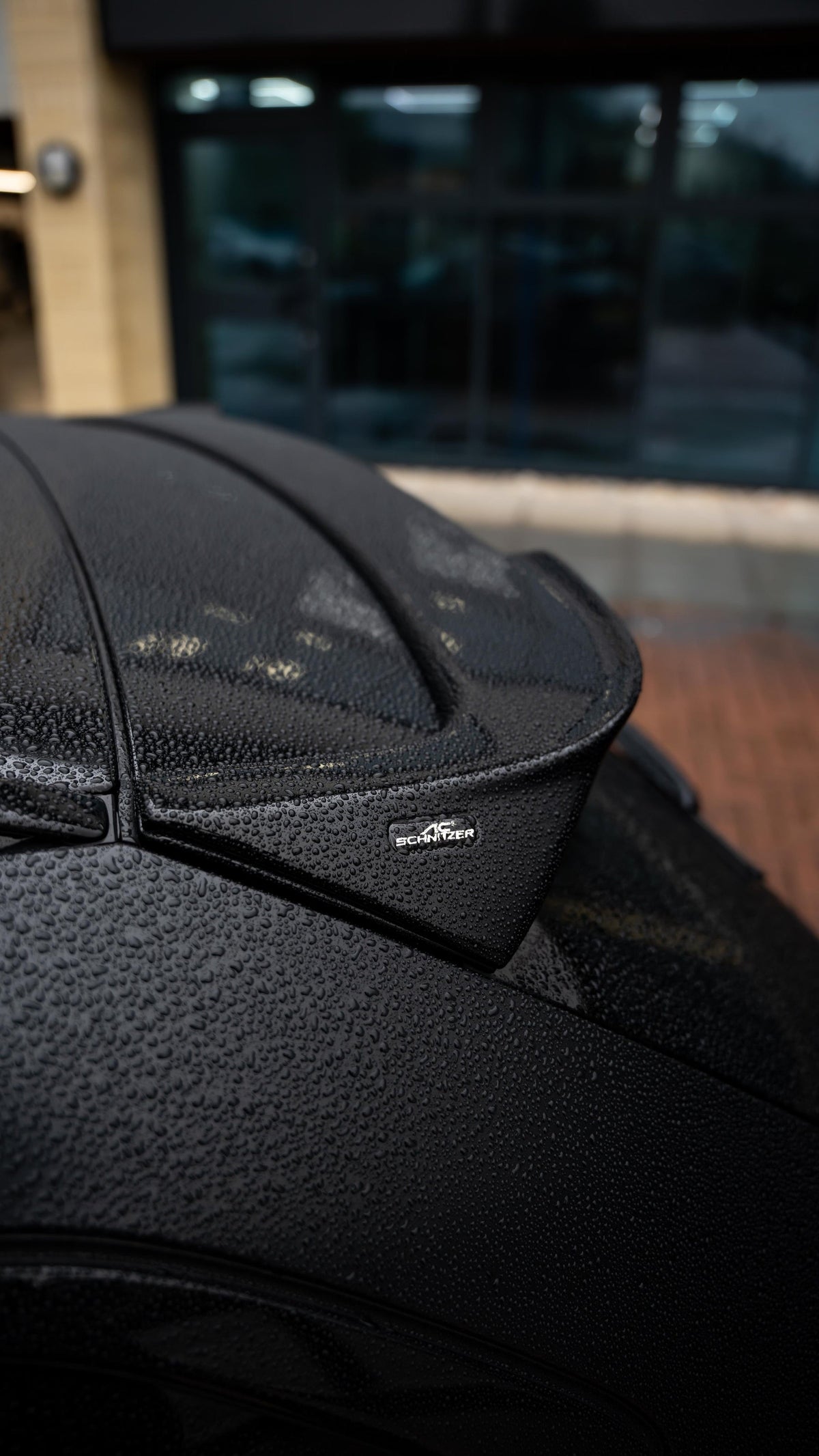 AC Schnitzer BMW M3 Touring G81 roof spoiler, sleek aerodynamic accessory mounted on the car's roof for improved style and performance.