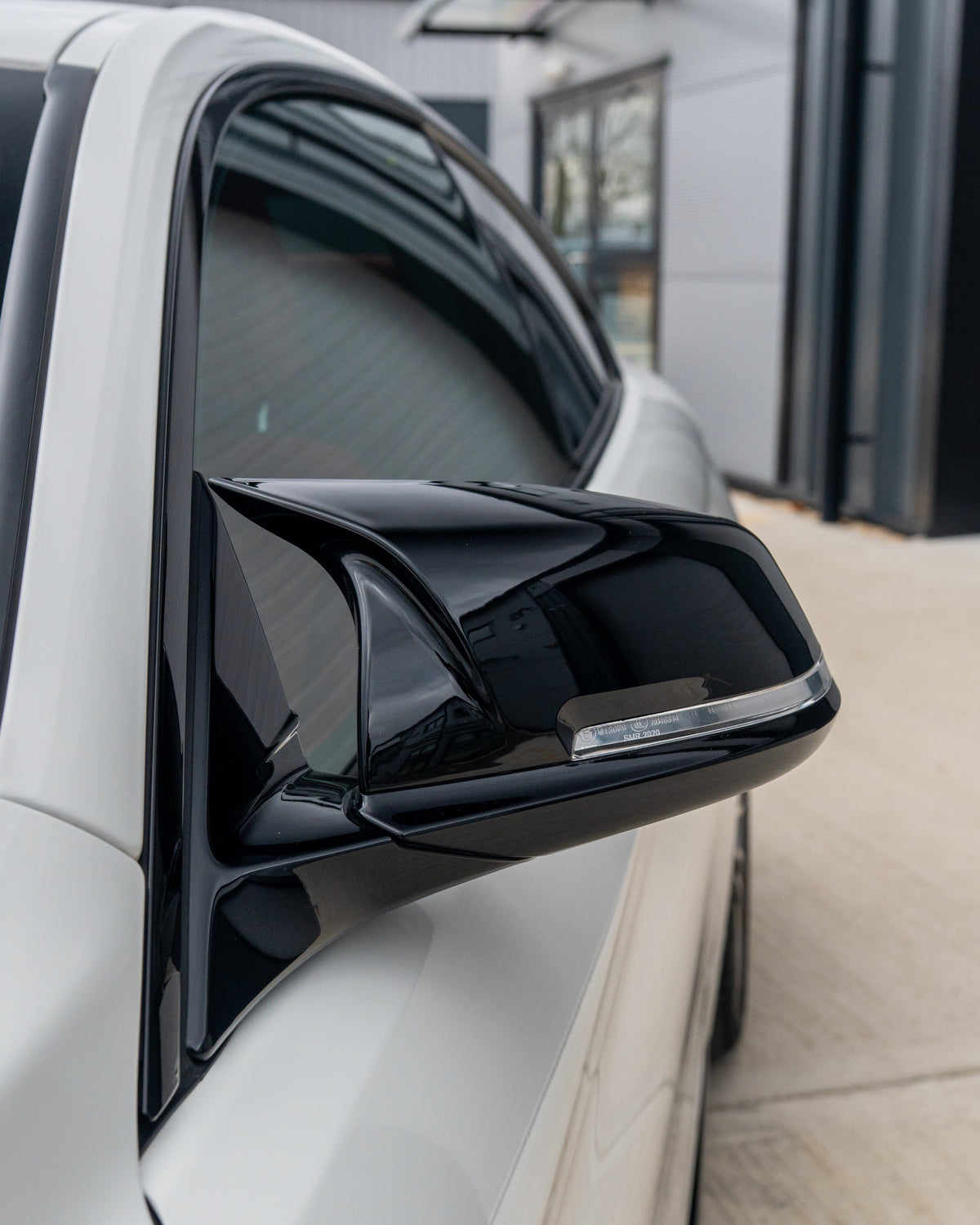 BMW Fxx series mirrors by CT Carbon, gloss black side mirrors for 1, 2, 3, and 4 Series with sleek, aerodynamic design.