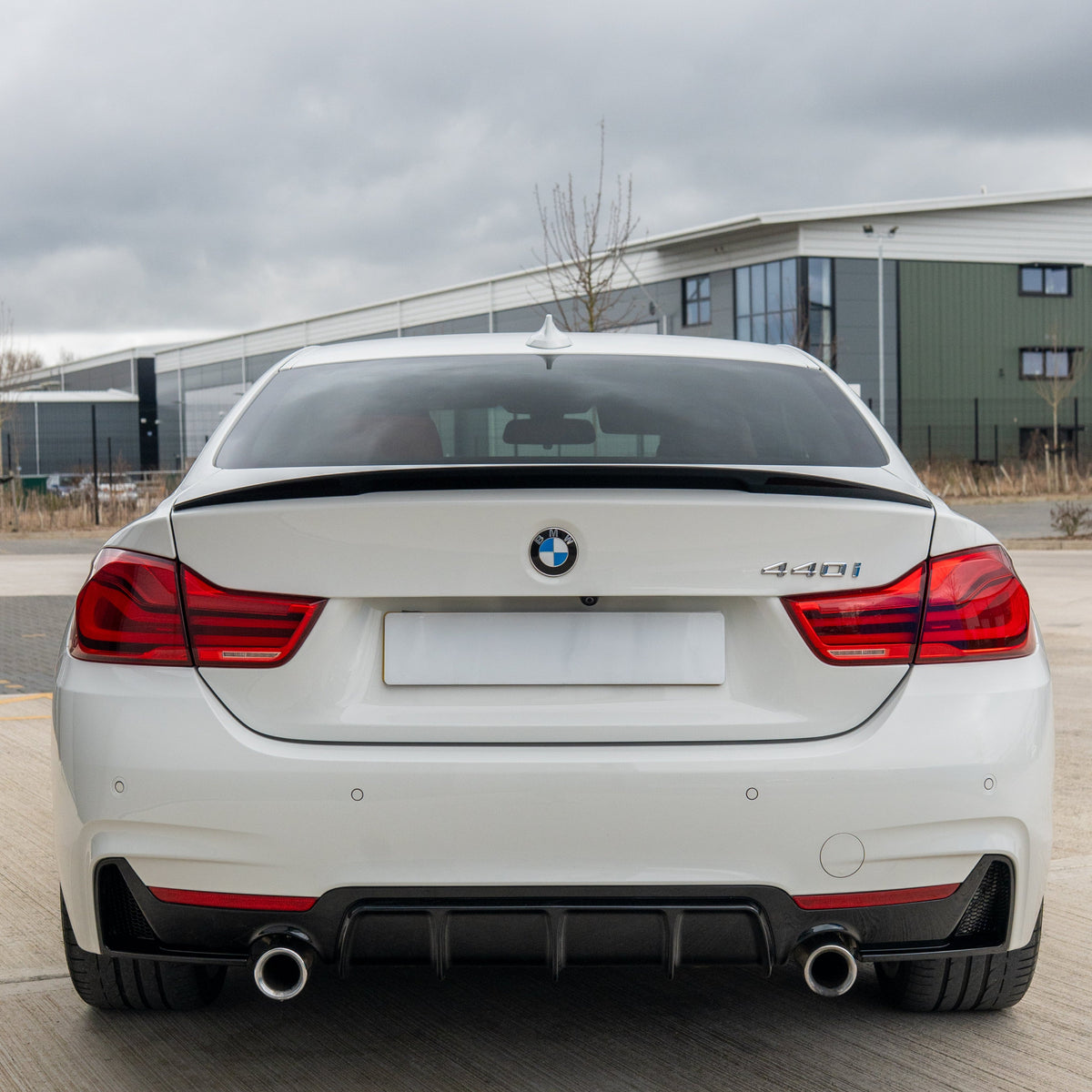BMW 4 Series F32/F33/F36 CT Carbon gloss black dual exit exhaust diffuser, V2, with sleek aerodynamic design.