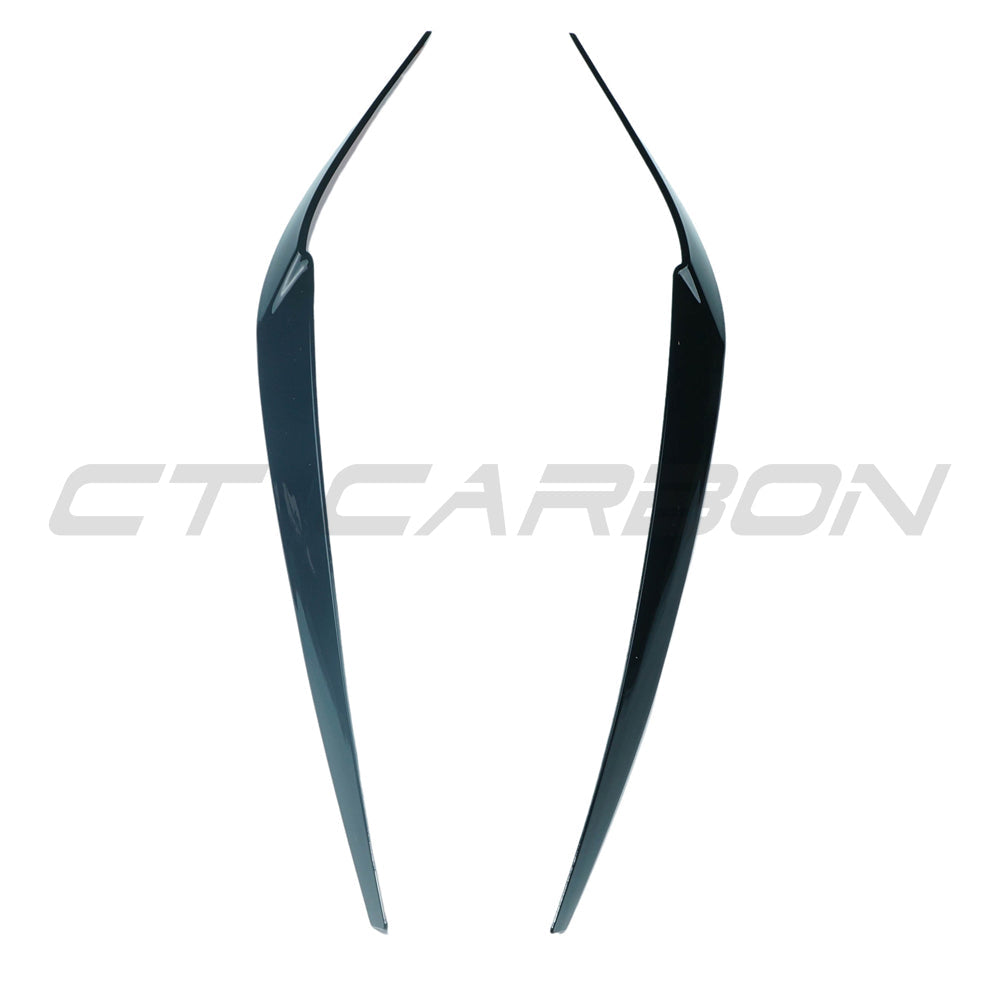 BMW 5 Series G30 gloss black headlight eyebrows accessory by CT Carbon, showing sleek carbon fiber eyelids on headlights.