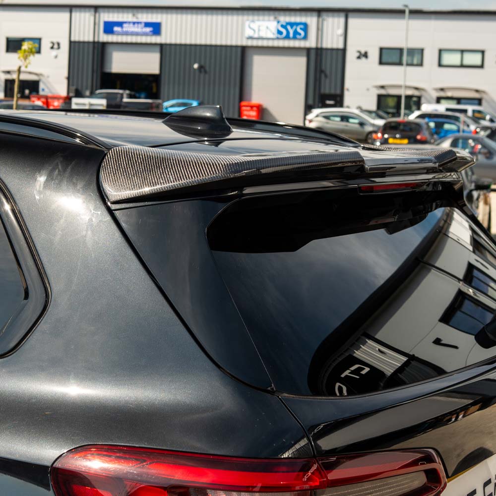 BMW G05 X5 CT Carbon full car carbon fibre kit, front and side view showcasing glossy black carbon fibre components.