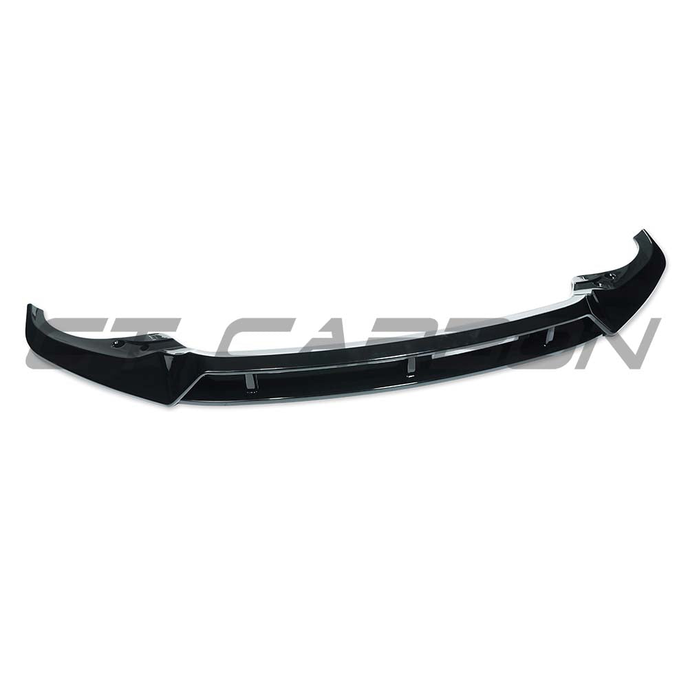 BMW G07 X7 2018-2022 CT Carbon gloss black front splitter installed on vehicle, enhancing sporty look and aerodynamics.