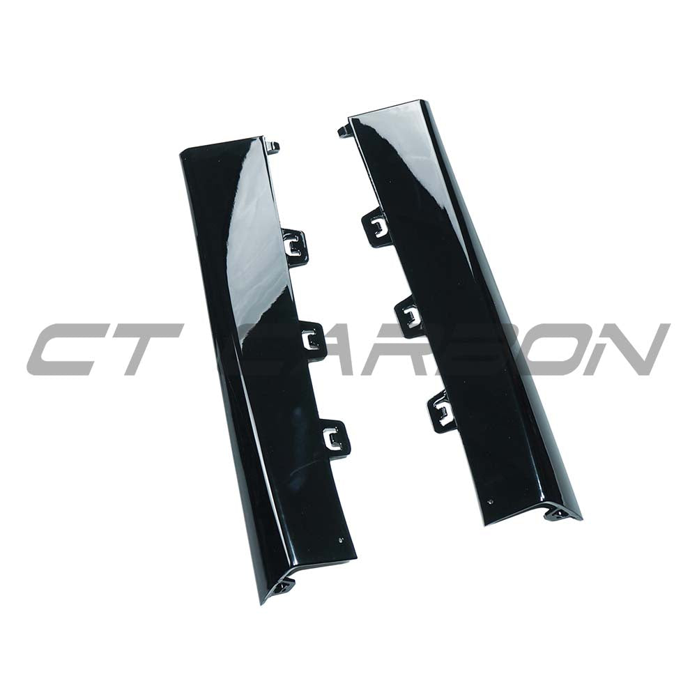 Mercedes E-Class W213 2020-2023 CT Carbon gloss black diffuser corners, close-up view of sleek automotive accessory.