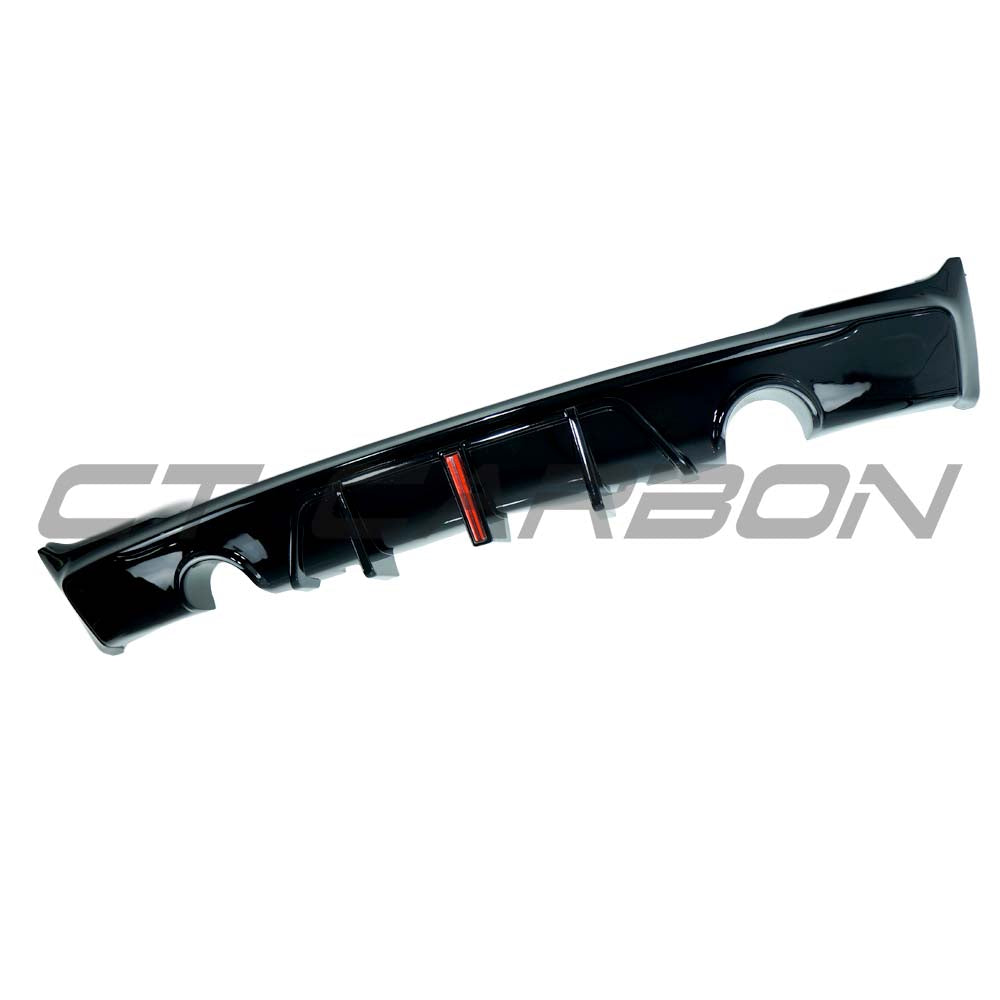 BMW F22/F23 2 Series 2014-2020 CT Carbon gloss black dual exhaust diffuser installed on the rear of the vehicle.