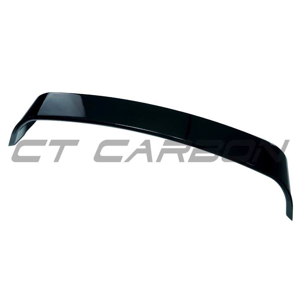 BMW G42 2 Series 2021+ CT Carbon gloss black trunk spoiler mounted on the car's rear for sporty style and aerodynamic enhancement.
