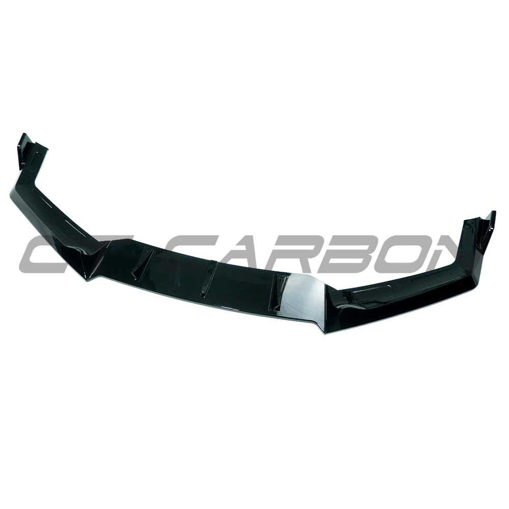 BMW G70 7 Series 2022+ CT Carbon gloss black splitter installed on front bumper, showcasing sleek aerodynamic design.