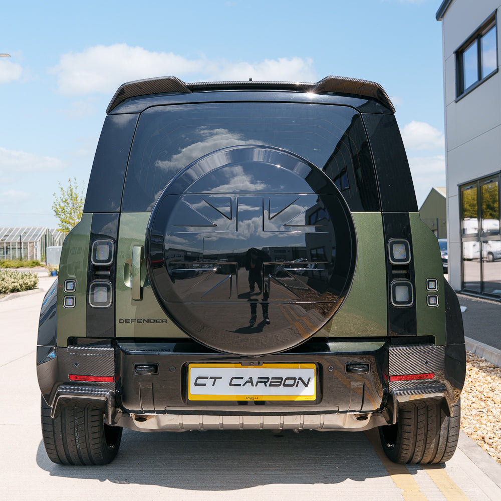 Gloss black spare wheel cover for Land Rover Defender L663 110 and 90 by CT Carbon, accessory with sleek finish.