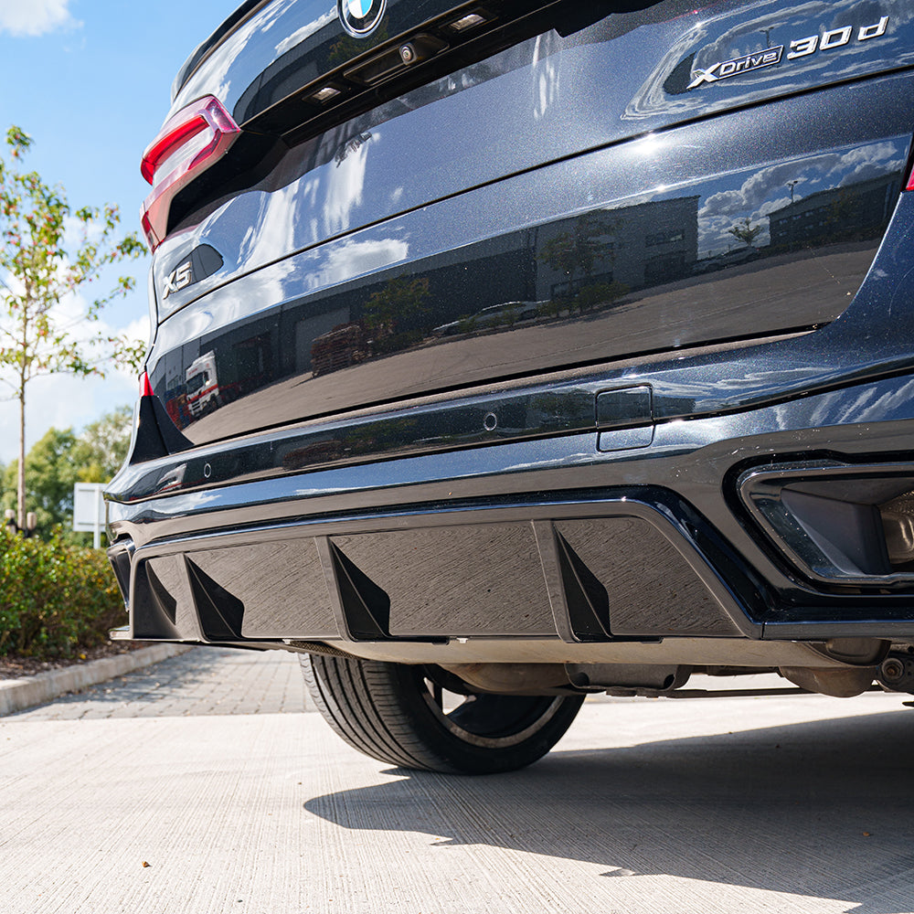 Full black plastic kit for BMW G05 X5 2018-2023 by CT Carbon, showing various car body parts in the image.