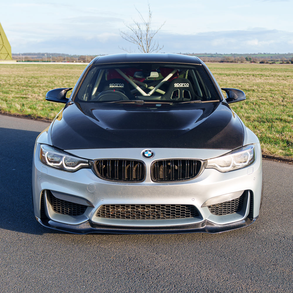 BMW M3 M4 F80 F82 F83 carbon fibre splitter by CT Carbon, showcasing its sleek aerodynamic design for 2014-2020 models.