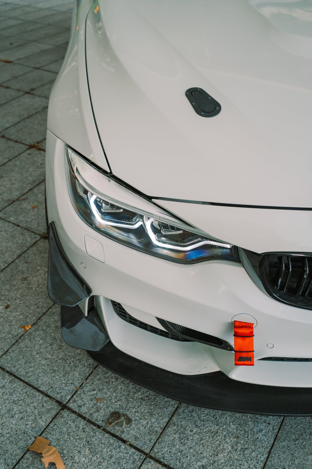 Carbon GT4 side canards for BMW M3 and M4 F80/F82, front bumper trim featuring black carbon fiber finish, Nineteen72 Performance.