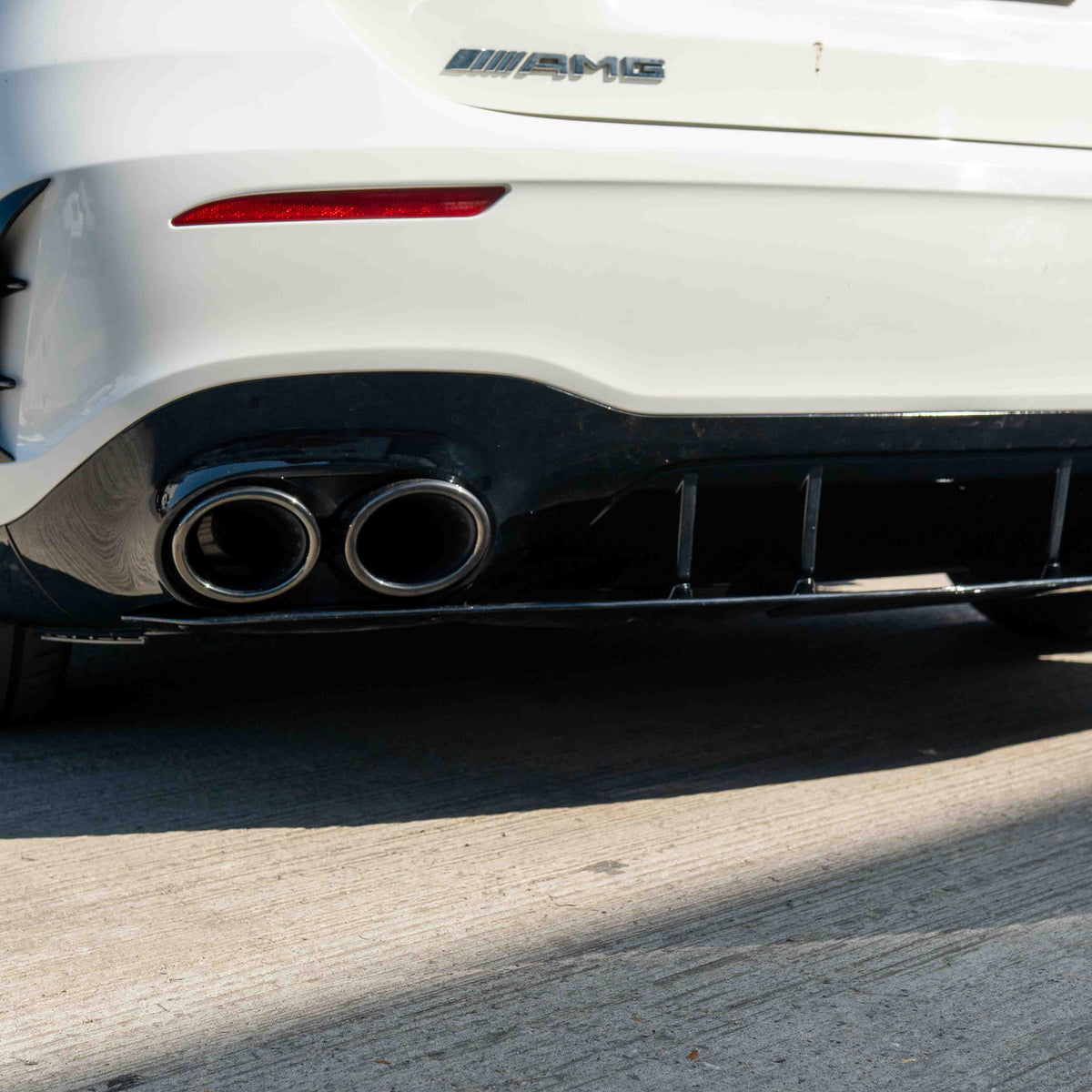 CT Carbon Mercedes A-Class W177/V177 2018-current gloss black quad tip diffuser, showcasing sleek aerodynamic design.