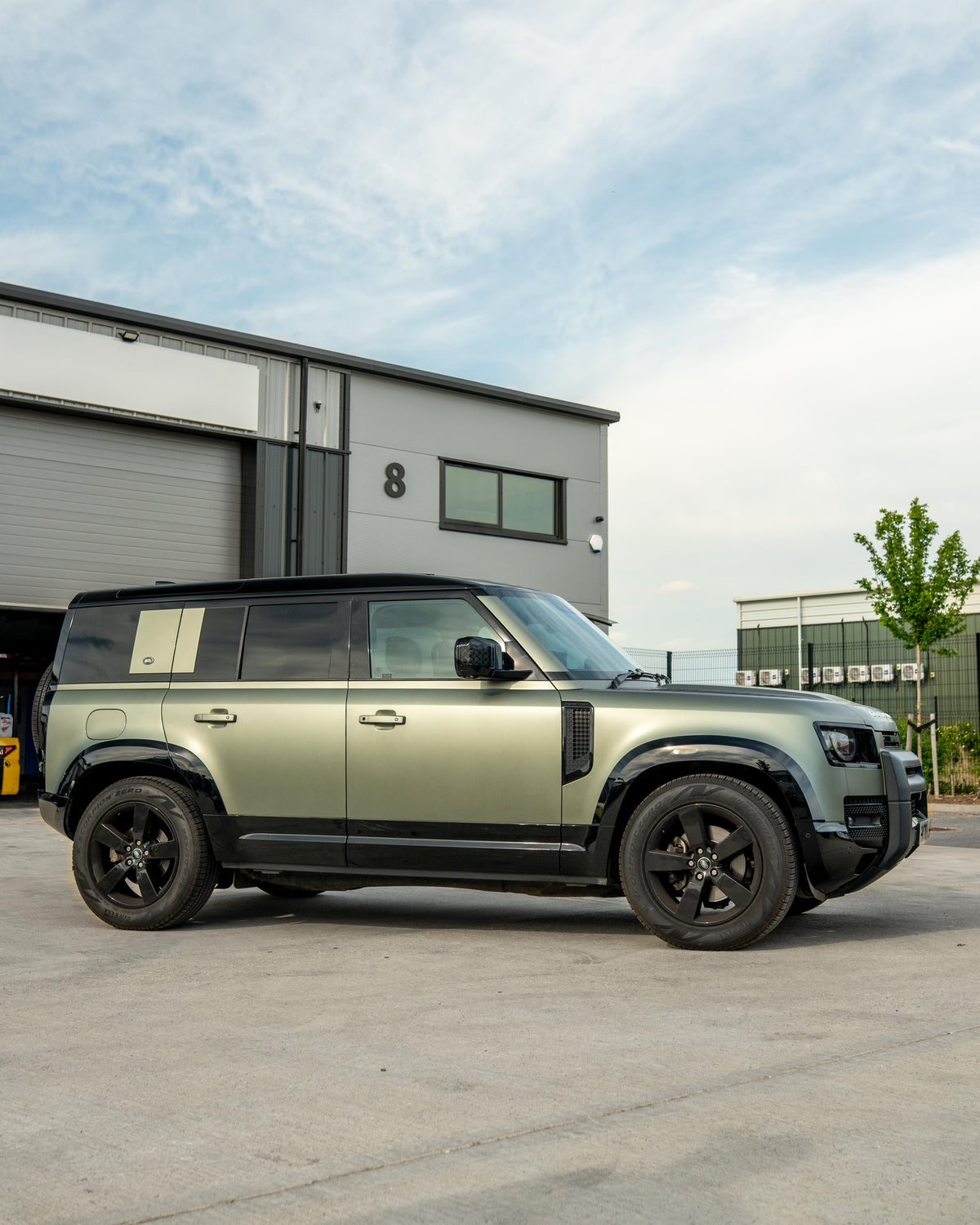 Gloss black door panels for Land Rover Defender L663 110 by CT Carbon, featuring sleek, high-quality automotive interior accents.