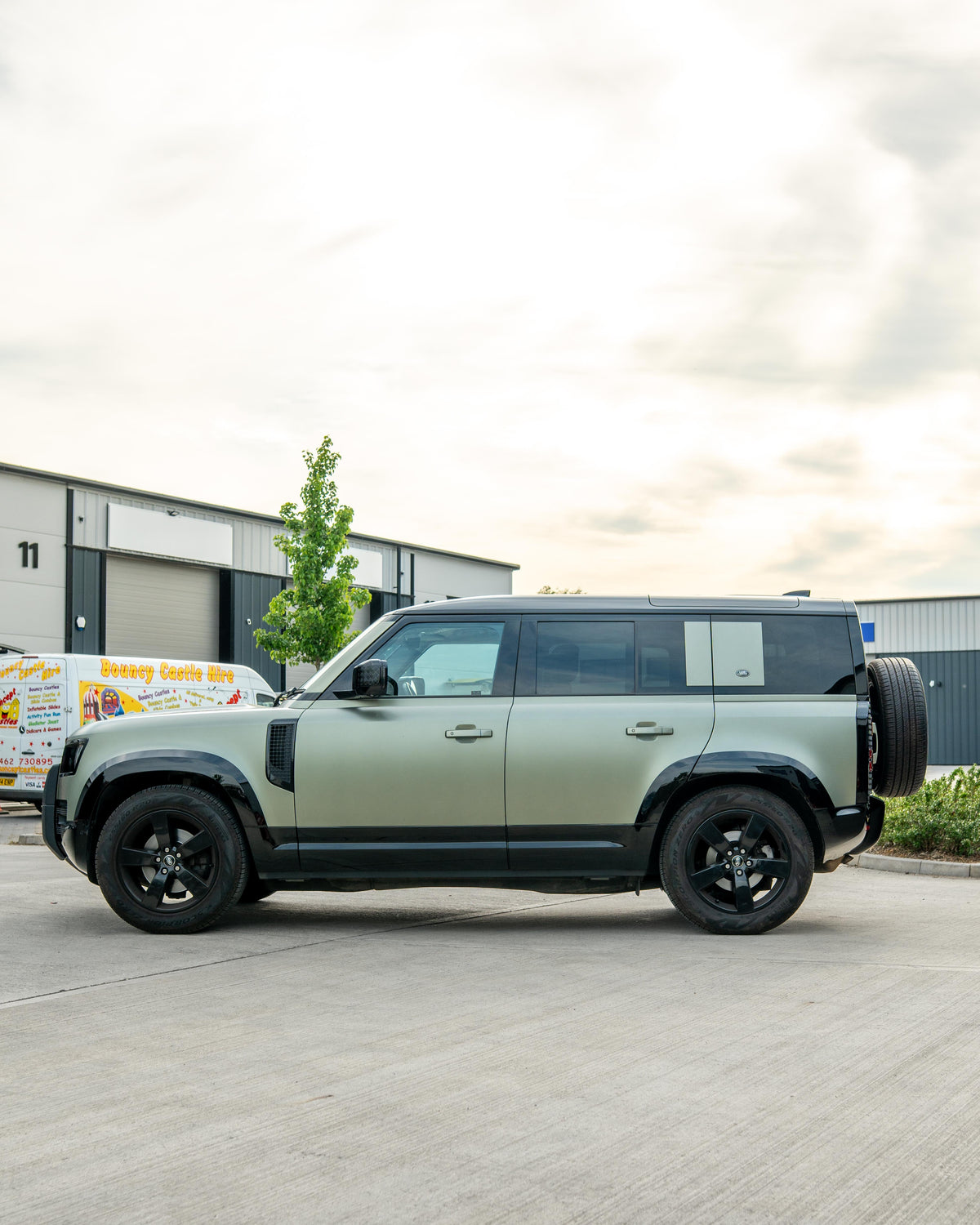 Gloss black door panels for Land Rover Defender L663 110 by CT Carbon, showing sleek exterior design and high-quality finish.