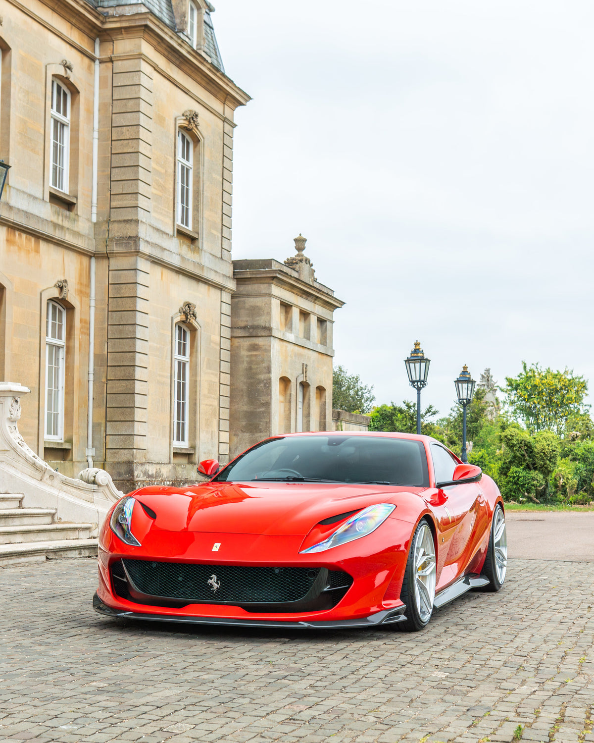 CT Carbon Ferrari 812 Superfast carbon fibre kit V1, showcasing detailed carbon fibre parts on a sleek sports car.
