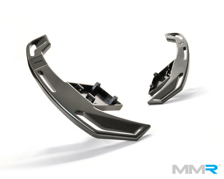 Dark anthracite MMX Performance steering wheel gear shift paddles for BMW E and F-Series, mounted on a sporty steering wheel.