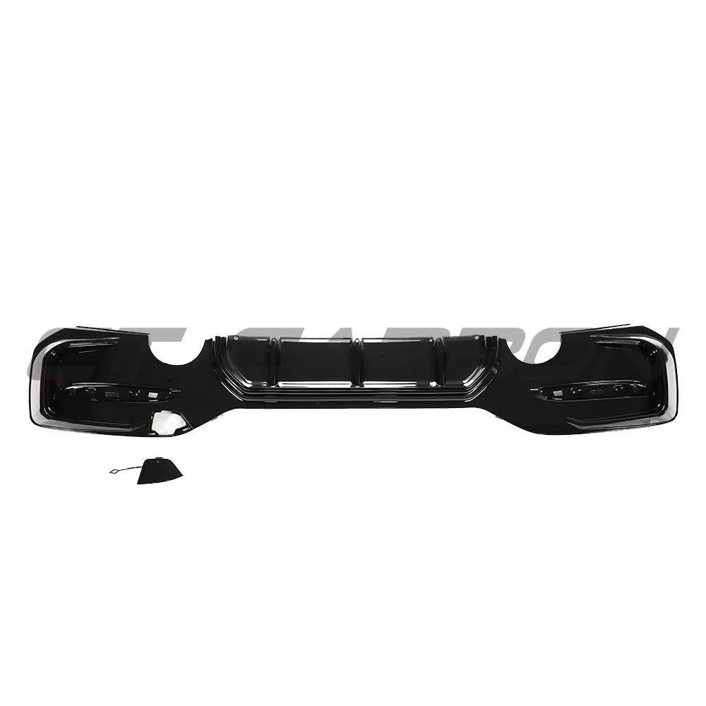 BMW F20/F21 1 Series LCI dual exit diffuser kit in gloss black by CT Carbon, shown from the front angle.