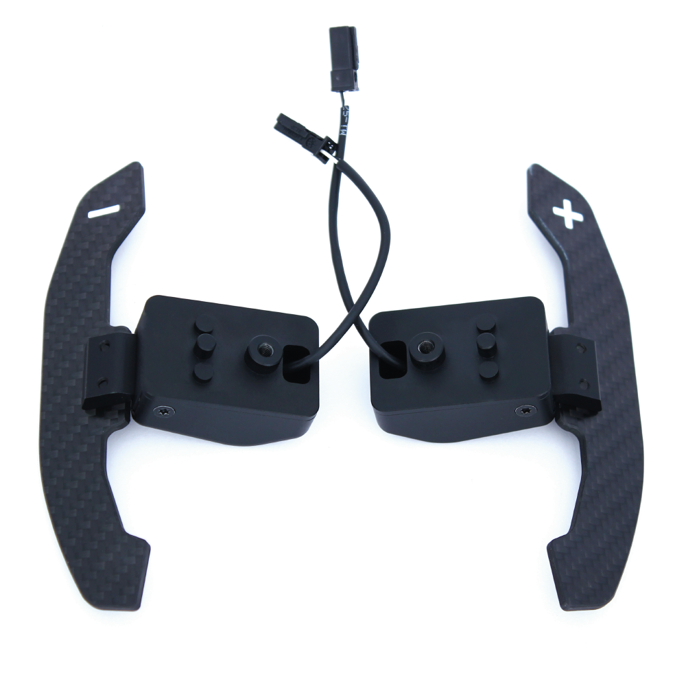 KMP Drivetrain magnetic shift paddles for BMW G8X F80, black metal with ergonomic design for sporty gear shifting.