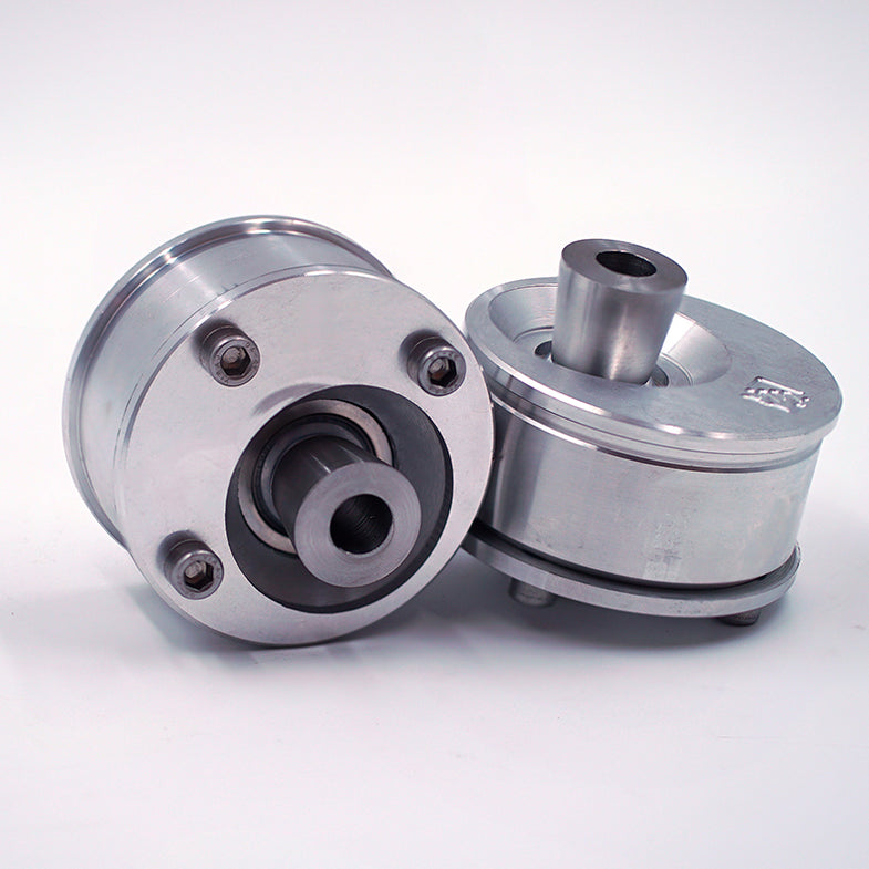 Suspension Secrets front offset caster bushes for BMW F80 M3 and F82 M4 suspension linkages, showing black rubber components.